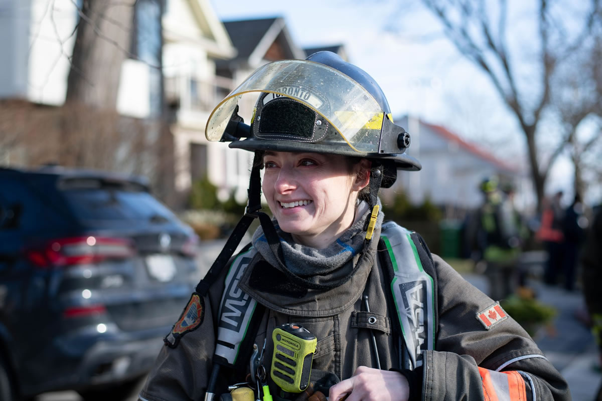 Female firefighter looking off camera